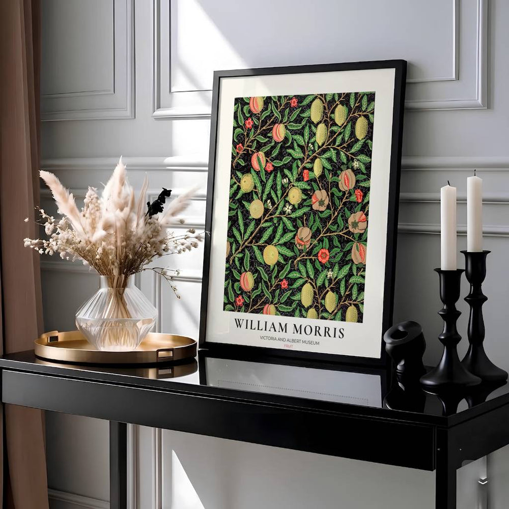 Moody Victorian kitchen decor print showing the famous 1862 William Morris Fruit pattern set against a high-contrast black backdrop.