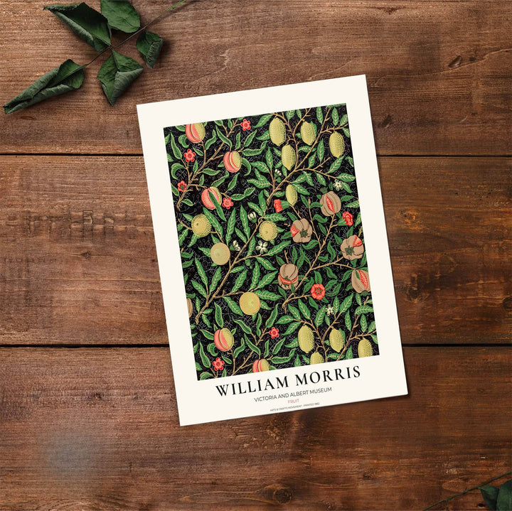 High-contrast fruit pattern artwork by William Morris featuring ripe pomegranates and lemons on a solid black field for modern homes.