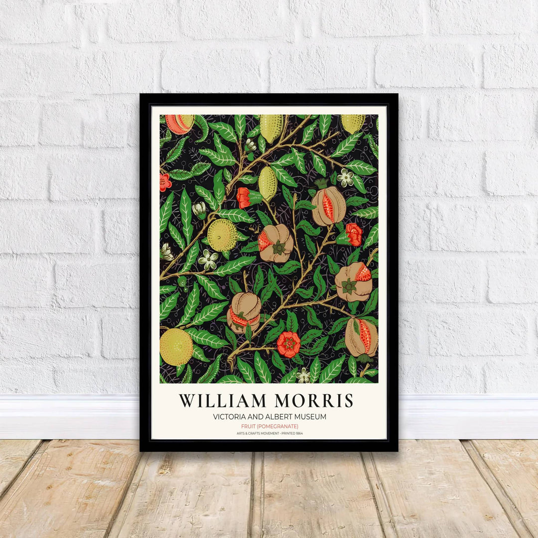 Vibrant botanical gallery wall piece featuring hanging William Morris lemons and open pomegranates surrounded by dense green leaves over a dark background. Shop versatile framed, unframed, and canvas options available at MapYourDreams.