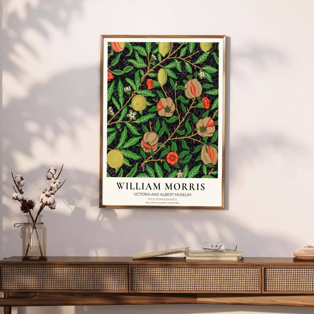 Symmetrical arrangement of hanging lemons, peaches, and open pomegranates by William Morris rendered in warm terracotta and yellow tones over a dark backdrop. Choose framed, unframed, and canvas options available at MapYourDreams.