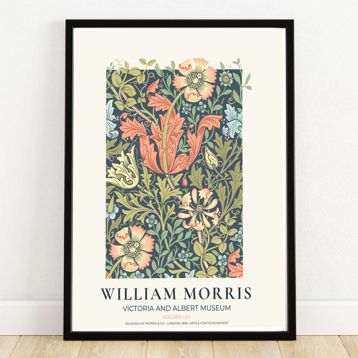 Entangling blushing peach lily trumpets and olive leaves on a slate background in a William Morris Golden Lily print. MapYourDreams provides framed, unframed, and canvas options available for home interior decoration.