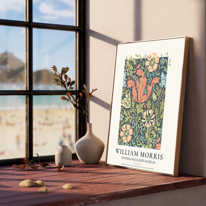 Elegant William Morris heritage wallpaper print showing lush peach lily trumpets framed by a clean cream museum margin. Explore durable framed, unframed, and canvas options available from MapYourDreams.