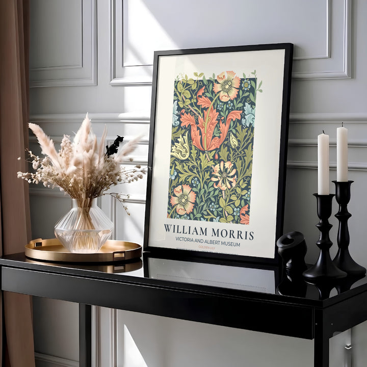 Intricate 1899 William Morris Golden Lily floral wallpaper design with soft peach blooms and museum text inside a cream border. Shop high quality framed, unframed, and canvas options available today at MapYourDreams.