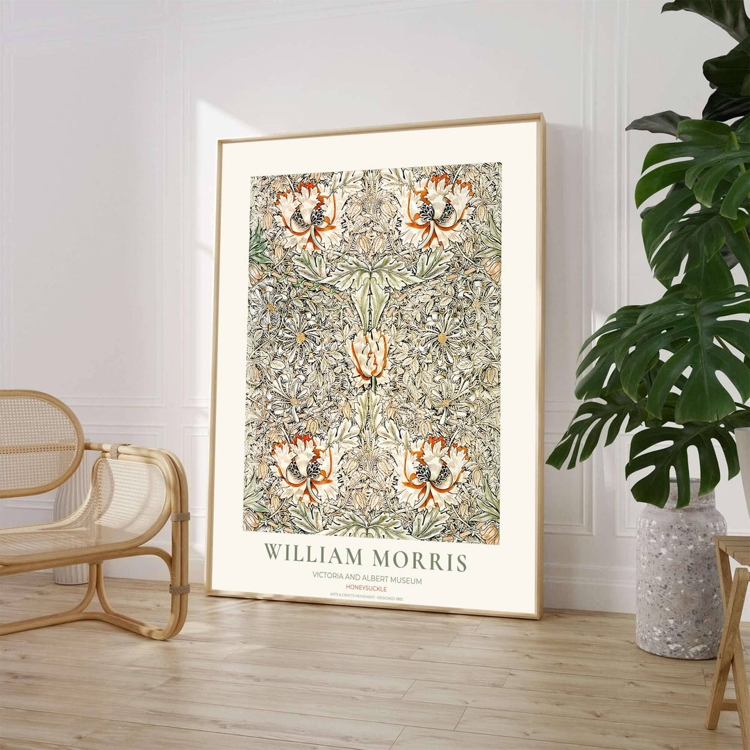 Close-up view of terracotta honeysuckle petals and winding botanical leaves from the William Morris Honeysuckle poster. MapYourDreams offers versatile framed, unframed, and canvas options available online.