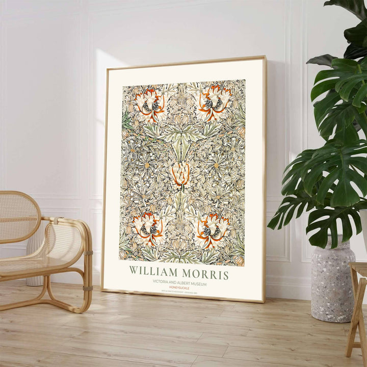 Close-up view of terracotta honeysuckle petals and winding botanical leaves from the William Morris Honeysuckle poster. MapYourDreams offers versatile framed, unframed, and canvas options available online.