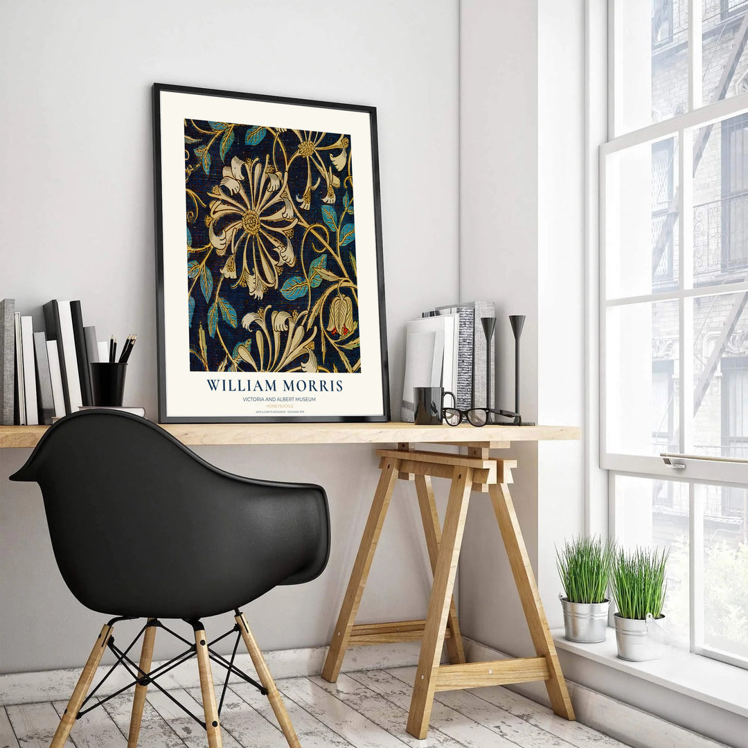 Winding golden honeysuckle vines and cream blossoms by William Morris rendered over a dark blue textured field. Choose high quality framed, unframed, and canvas options available at MapYourDreams today.