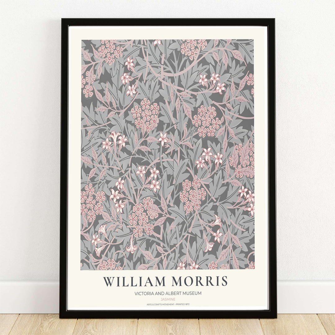 Winding grey stems and blush pink jasmine blossoms by William Morris rendered over charcoal grey. Choose high quality framed, unframed, and canvas options available at MapYourDreams today.