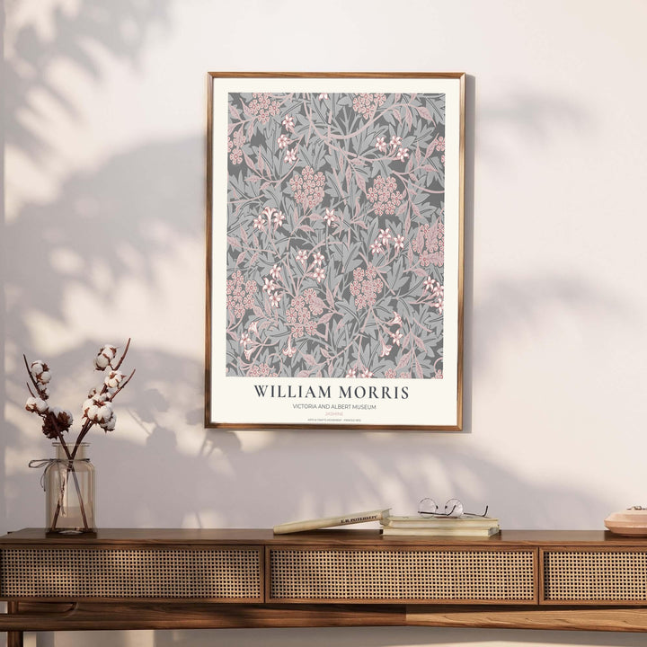 Archival exhibition poster of the grey William Morris Jasmine design with Victoria &amp; Albert Museum text. Discover our tailored framed, unframed, and canvas options available at MapYourDreams.