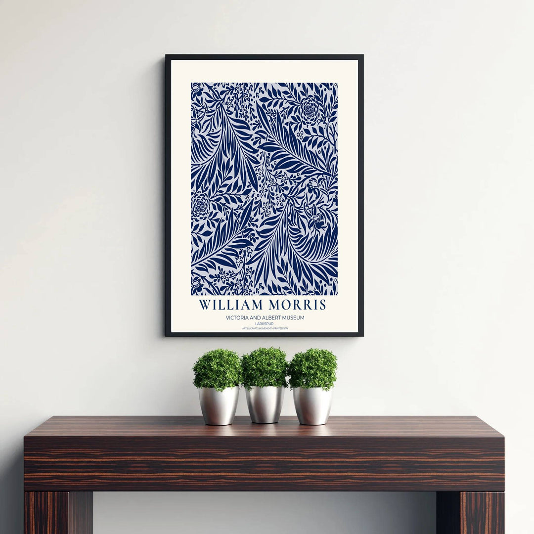 High-contrast navy blue and white foliage in a restored vintage William Morris Larkspur exhibition print. MapYourDreams offers custom framed, unframed, and canvas options available for any room decor.