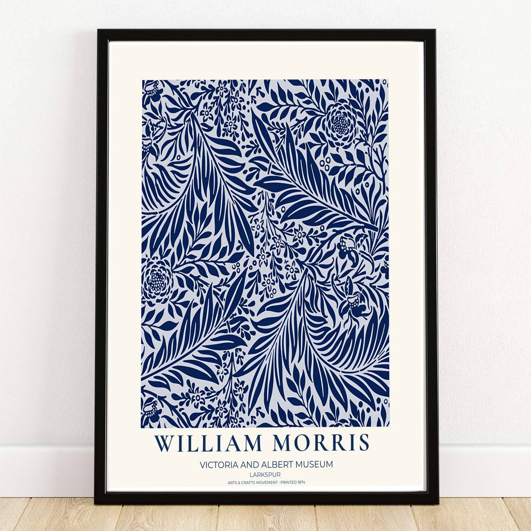 Deep navy blue larkspur blossoms and sweeping leaves over a white background in a William Morris Larkspur print. MapYourDreams provides framed, unframed, and canvas options available for home interior decoration.