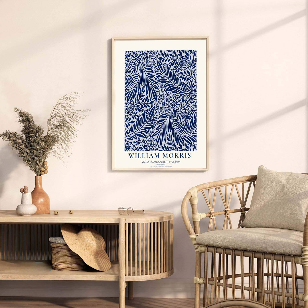 Detailed botanical illustration of navy larkspur flowers and willow leaves on sweeping vines by William Morris. MapYourDreams provides archival framed, unframed, and canvas options available to buy.