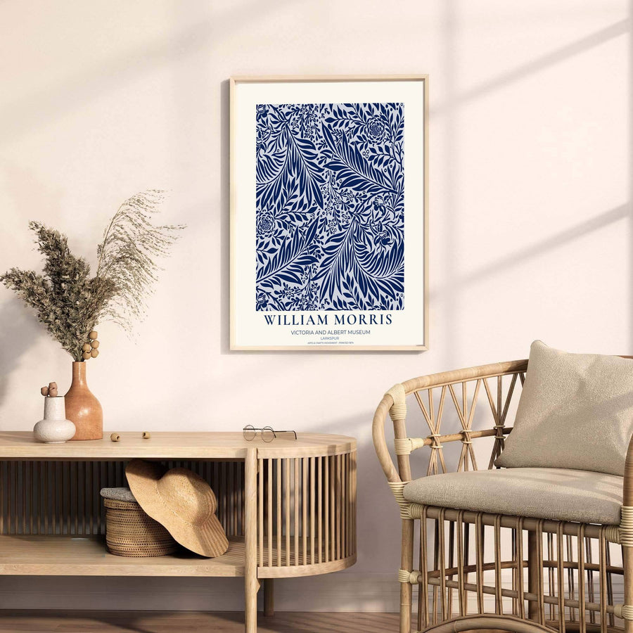 Detailed botanical illustration of navy larkspur flowers and willow leaves on sweeping vines by William Morris. MapYourDreams provides archival framed, unframed, and canvas options available to buy.