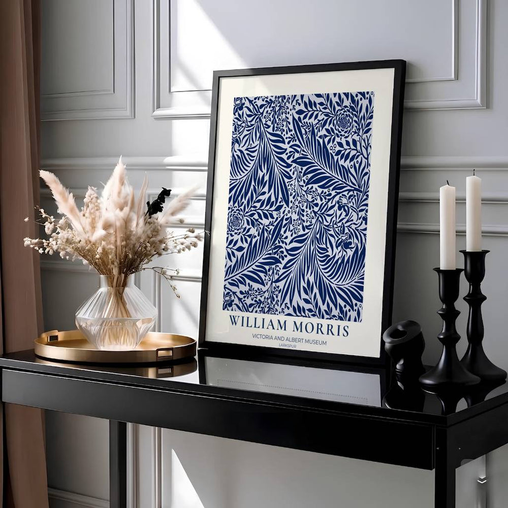 Intricate 1872 William Morris Larkspur wallpaper pattern in high-contrast navy and white with V&A museum text. Shop high quality framed, unframed, and canvas options available today at MapYourDreams.