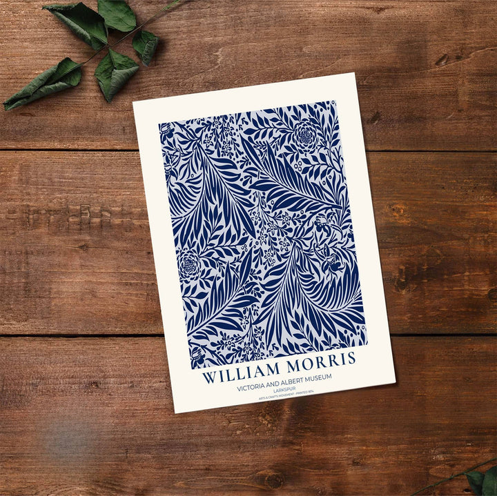 Crisp navy and white botanical decor print featuring Larkspur foliage by William Morris, framed in a clean layout. Order your favorite framed, unframed, and canvas options available at MapYourDreams.