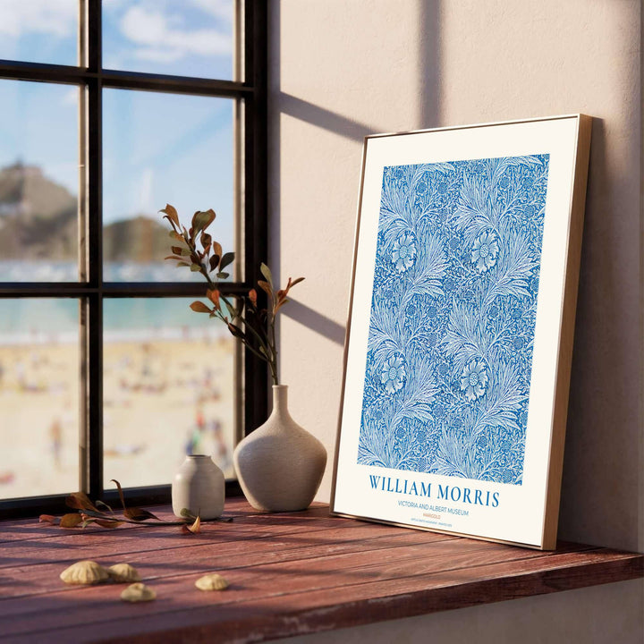 Close-up view of cobalt blue marigold petals, scrolling vines, and white background details from the William Morris Marigold poster. MapYourDreams offers versatile framed, unframed, and canvas options available online.