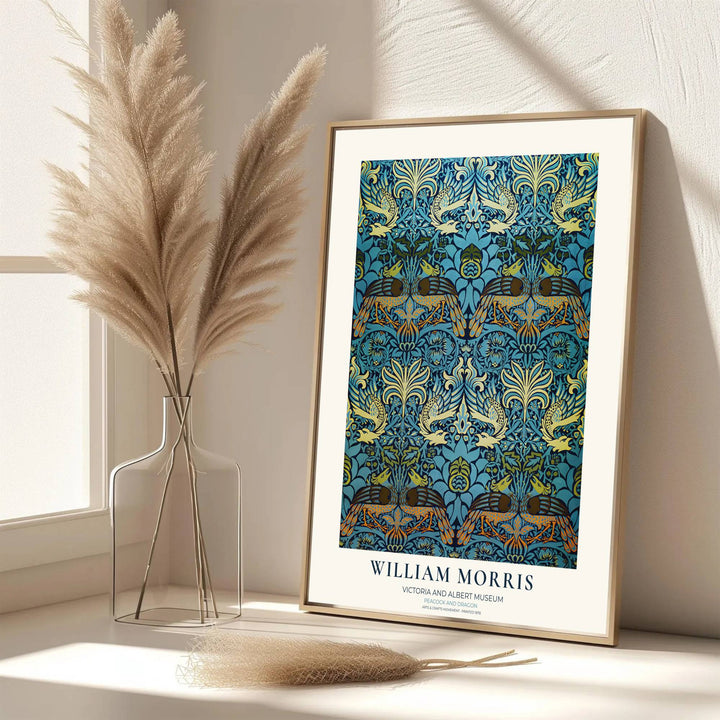 Beautiful William Morris blue wall art poster showcasing medieval peacock patterns with V&amp;A text. MapYourDreams has ready-to-ship framed, unframed, and canvas options available for wall decor collections.