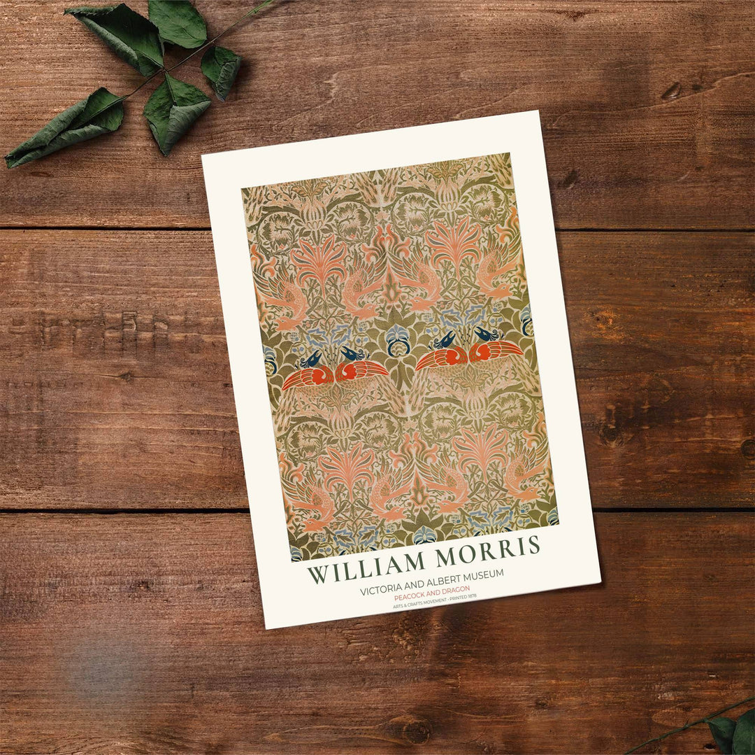 Sage green leaves weave around coral peacocks in a sophisticated Arts and Crafts design from 1878. MapYourDreams offers versatile framed, unframed, and canvas options available to refresh your dining area wall layout.