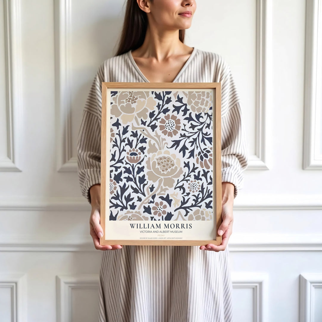 Beige flowers and dark grey foliage highlight the central design of this William Morris Peony print. Find stunning framed, unframed, and canvas options available at MapYourDreams for a striking gallery wall display.