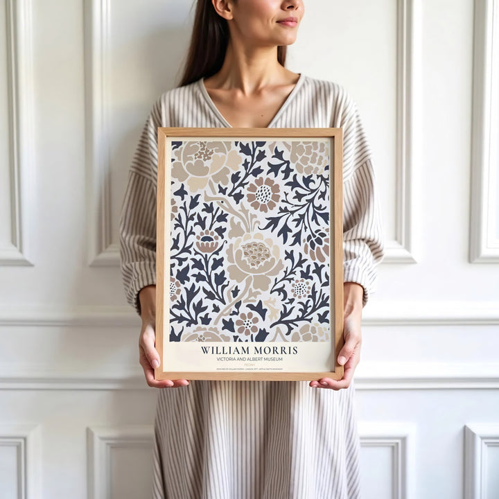 Beige flowers and dark grey foliage highlight the central design of this William Morris Peony print. Find stunning framed, unframed, and canvas options available at MapYourDreams for a striking gallery wall display.