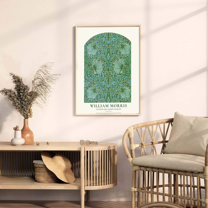 Gentle green leaves and blue flowers fill an arch in this restored William Morris Pimpernel wall art piece. Buy long-lasting framed, unframed, and canvas options available at MapYourDreams to expand your home art collection.