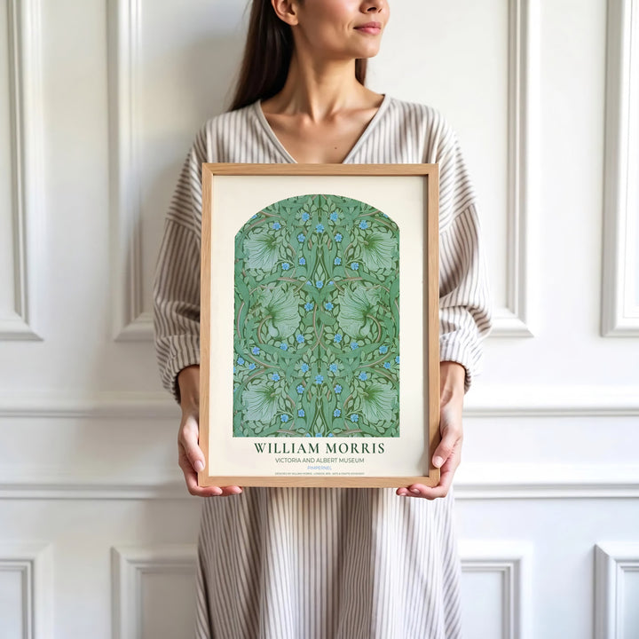 Blue pimpernel flowers and green foliage highlight the arched design of this William Morris Pimpernel print. Find stunning framed, unframed, and canvas options available at MapYourDreams for a gallery wall display.
