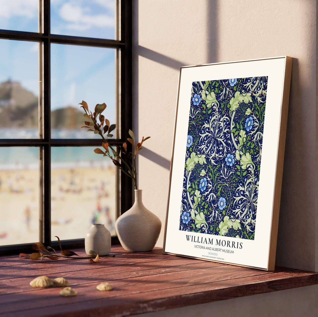 Sinuous ocean tendrils wrap around small blue flowers in this William Morris Seaweed art print. MapYourDreams provides archival framed, unframed, and canvas options available for nature-inspired home interior decoration.