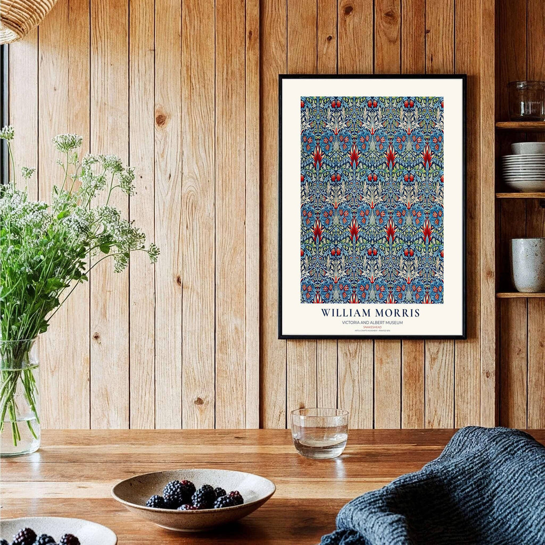 Crimson flower shapes swirl across deep blue in this William Morris Snakeshead art print. Discover ready-to-hang framed, unframed, and canvas options available at MapYourDreams for effortless room decoration.