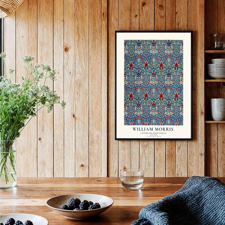 Crimson flower shapes swirl across deep blue in this William Morris Snakeshead art print. Discover ready-to-hang framed, unframed, and canvas options available at MapYourDreams for effortless room decoration.