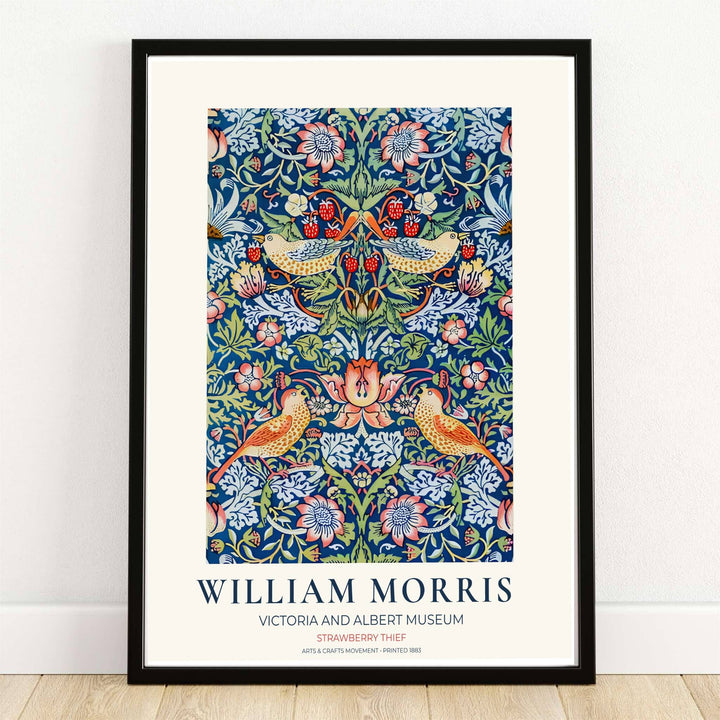 Thrushes steal ripe red strawberries on cobalt blue in this William Morris Strawberry Thief print. MapYourDreams supplies this vintage bird artwork in framed, unframed, and canvas options available for dining room wall decor.