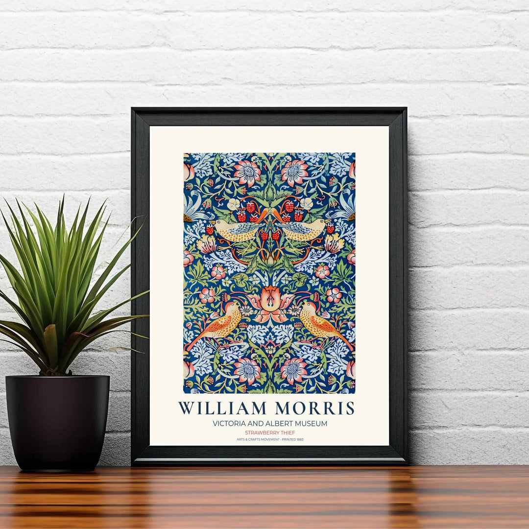 Speckled birds reach for red strawberries in this William Morris Strawberry Thief art print. Discover ready-to-hang framed, unframed, and canvas options available at MapYourDreams for effortless room decoration.