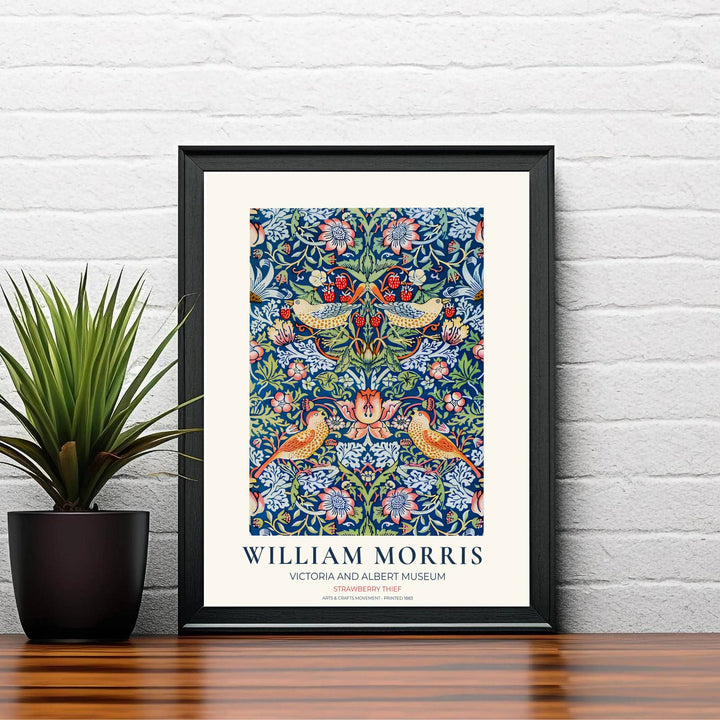 Speckled birds reach for red strawberries in this William Morris Strawberry Thief art print. Discover ready-to-hang framed, unframed, and canvas options available at MapYourDreams for effortless room decoration.