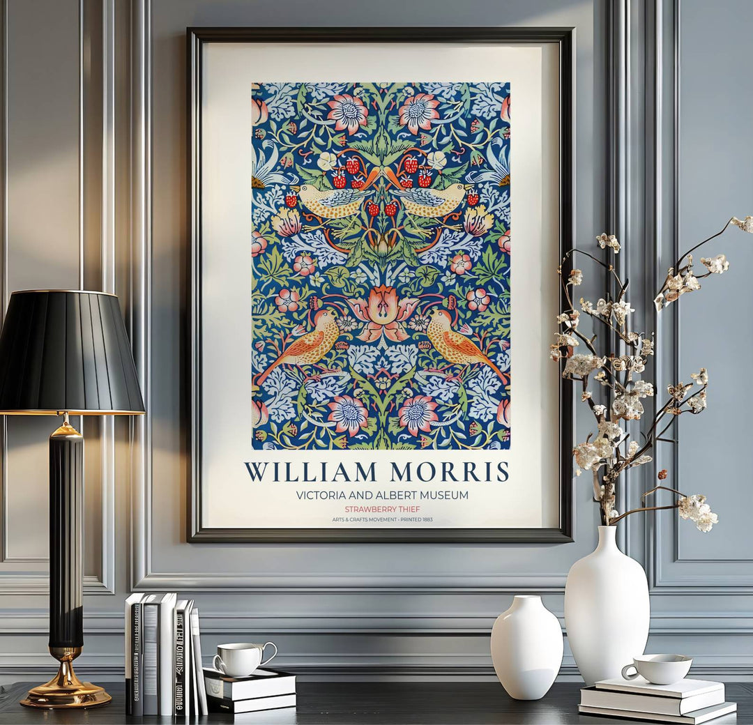 Crimson berries and golden birds decorate this restored William Morris Strawberry Thief wall art piece. Buy long-lasting framed, unframed, and canvas options available at MapYourDreams to expand your home art collection.