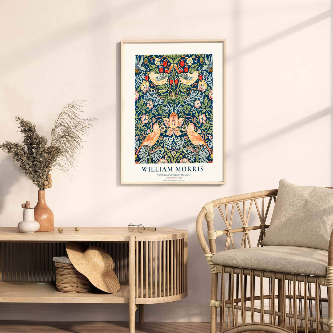 Authentic museum margin encloses thrush birds and green vines in this William Morris Strawberry Thief wall print. Buy long-lasting framed, unframed, and canvas options available at MapYourDreams for gallery wall collections.