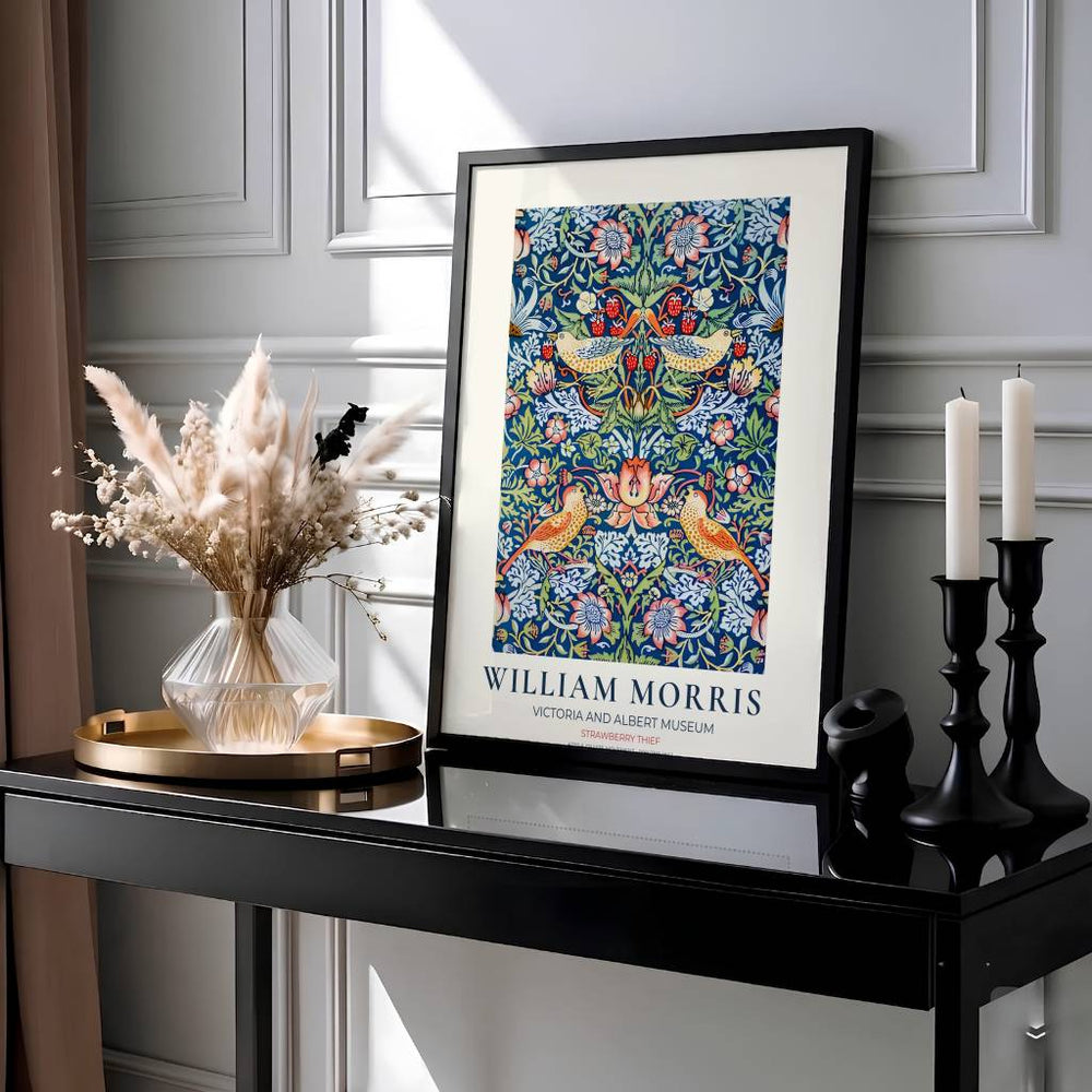 Golden birds and red berries fill a dark blue background in this 1883 William Morris Strawberry Thief poster. Discover high-quality framed, unframed, and canvas options available at MapYourDreams to style your living room.