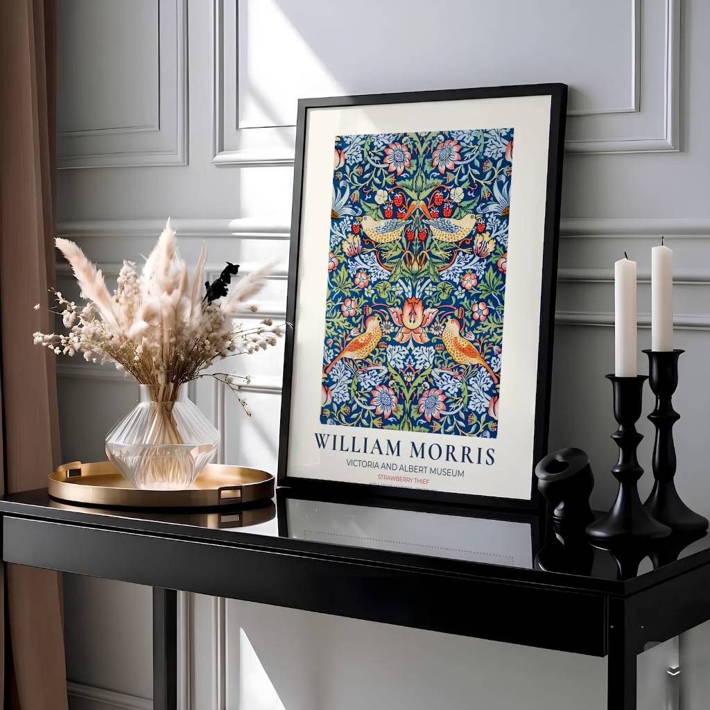 Golden birds and red berries fill a dark blue background in this 1883 William Morris Strawberry Thief poster. Discover high-quality framed, unframed, and canvas options available at MapYourDreams to style your living room.