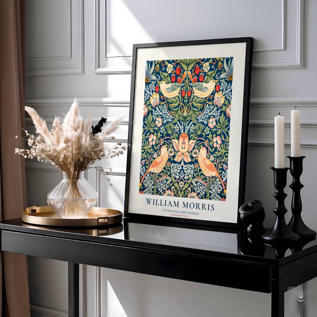 Classic museum typography frames blue thrush birds in this William Morris Strawberry Thief exhibition print. MapYourDreams provides archival framed, unframed, and canvas options available for timeless home wall decor.
