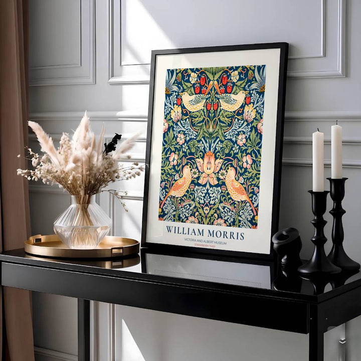 Classic museum typography frames blue thrush birds in this William Morris Strawberry Thief exhibition print. MapYourDreams provides archival framed, unframed, and canvas options available for timeless home wall decor.