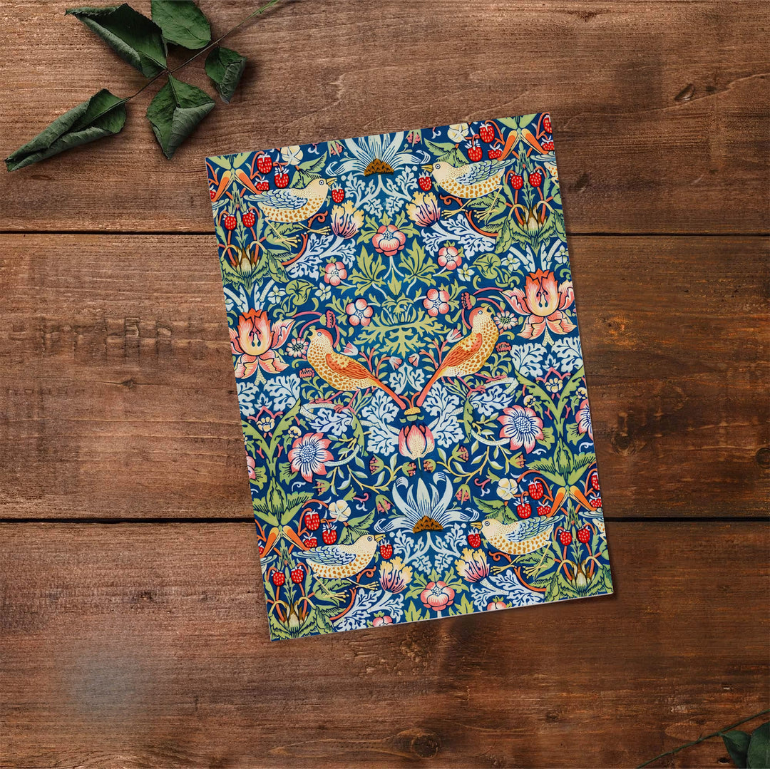Swirling floral vines fill the entire page with thrushes in this vintage William Morris Strawberry Thief design for wall decor. MapYourDreams offers versatile framed, unframed, and canvas options available to refresh your space.