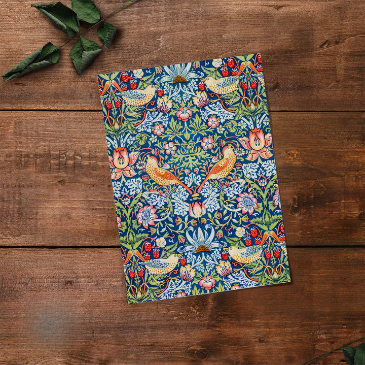 Swirling floral vines fill the entire page with thrushes in this vintage William Morris Strawberry Thief design for wall decor. MapYourDreams offers versatile framed, unframed, and canvas options available to refresh your space.