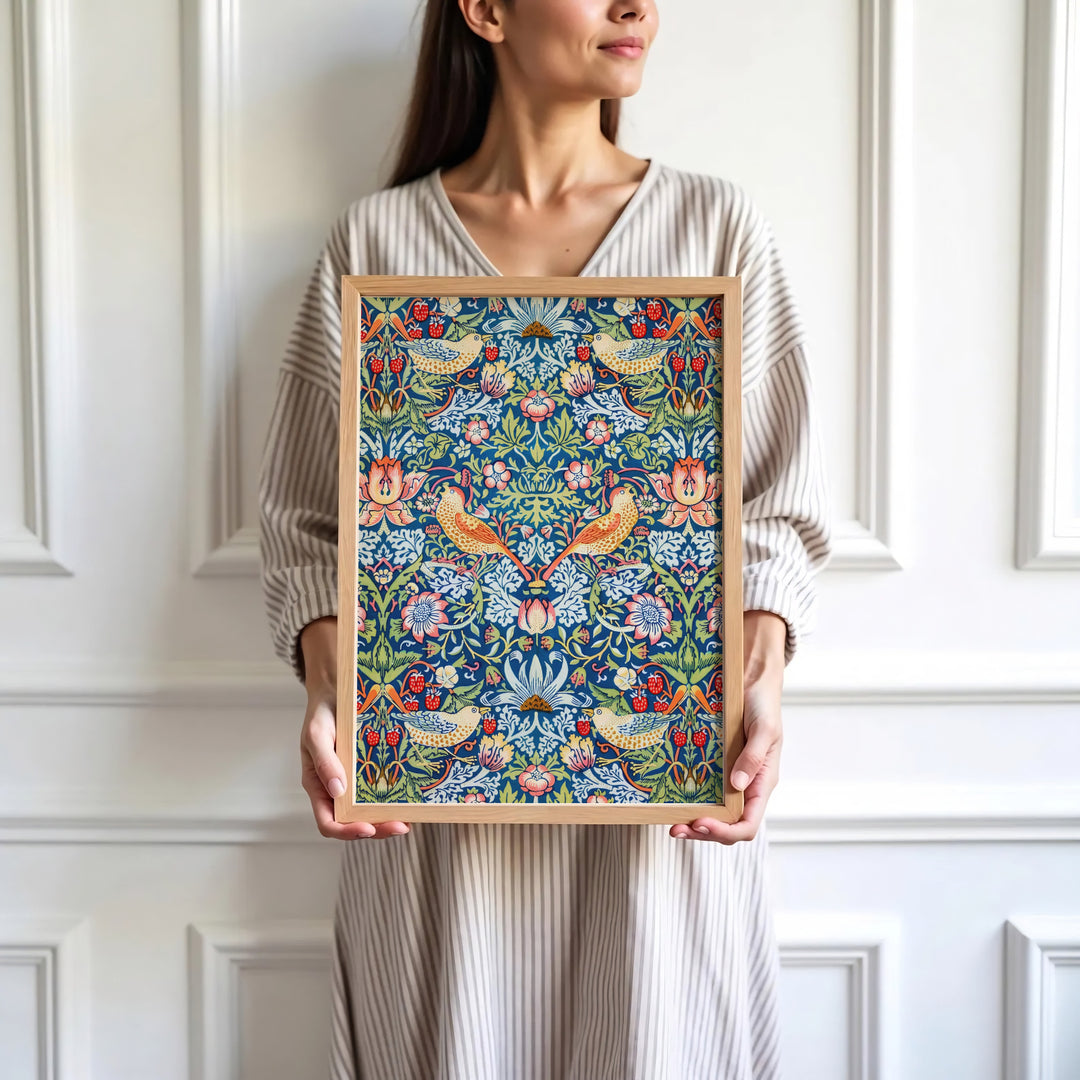 Bright red strawberries and blue birds highlight the full-bleed design of this William Morris Strawberry Thief print. Find stunning framed, unframed, and canvas options available at MapYourDreams for gallery walls.