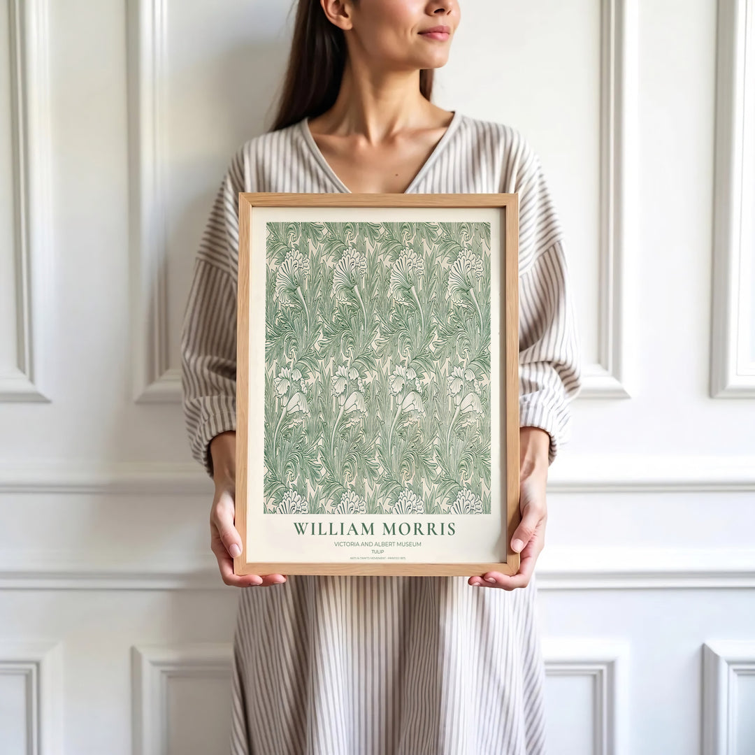 Green tulip heads and delicate foliage highlight the central design of this William Morris Tulip print. Find stunning framed, unframed, and canvas options available at MapYourDreams for gallery wall displays.