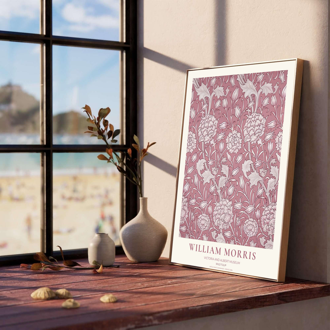 Delicate cream tulip outlines and soft pink background tones define this 1884 William Morris Wild Tulip Victoria and Albert Museum poster. Discover tailored framed, unframed, and stretched canvas print options at MapYourDreams.
