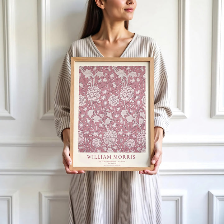Deep dusty rose background layers under off-white botanical tulip shapes in this William Morris Wild Tulip poster from the Victoria and Albert Museum archive. Order framed, unframed, or canvas print options at MapYourDreams.