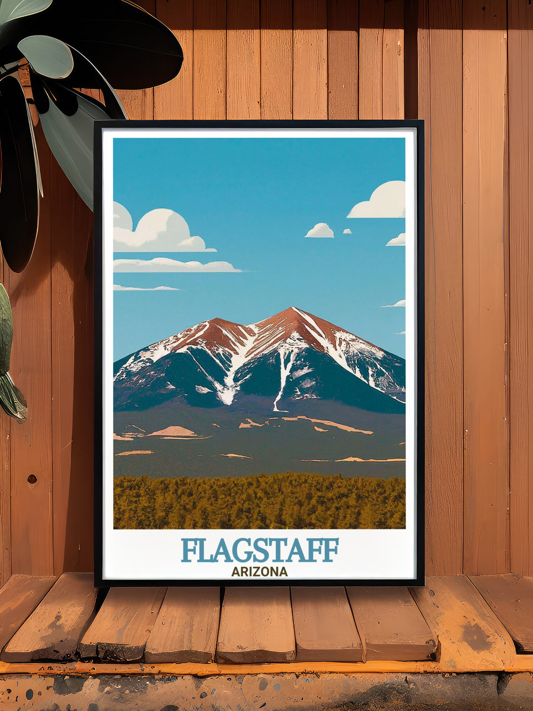 Flagstaff Arizona art print features the stunning landscape of Northern Arizona, where the San Francisco Peaks rise above the desert floor. This travel poster is perfect for anyone looking to add a touch of the Southwests wild beauty to their home decor.