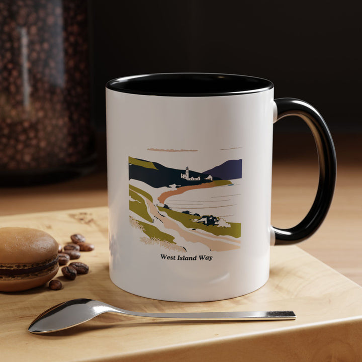 A West Island Way mug featuring stunning artwork of the island trail. Perfect for anyone who loves nature and hiking, it is ideal for enjoying coffee or tea. This mug is microwave and dishwasher safe for easy use.