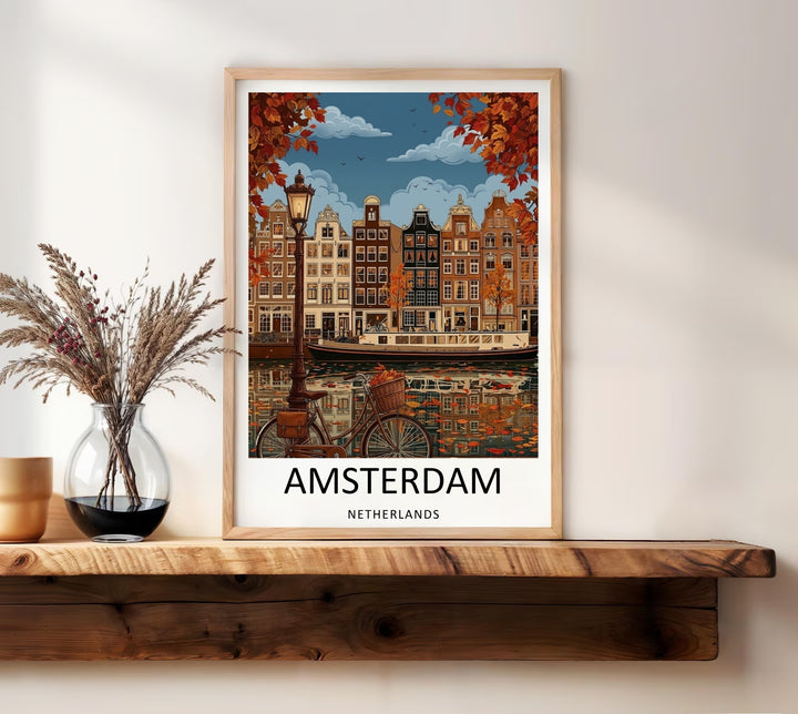 High-end travel poster with bold, modern typography reading Amsterdam Netherlands centered over an ornate illustration of waterfront townhouses and falling leaves.