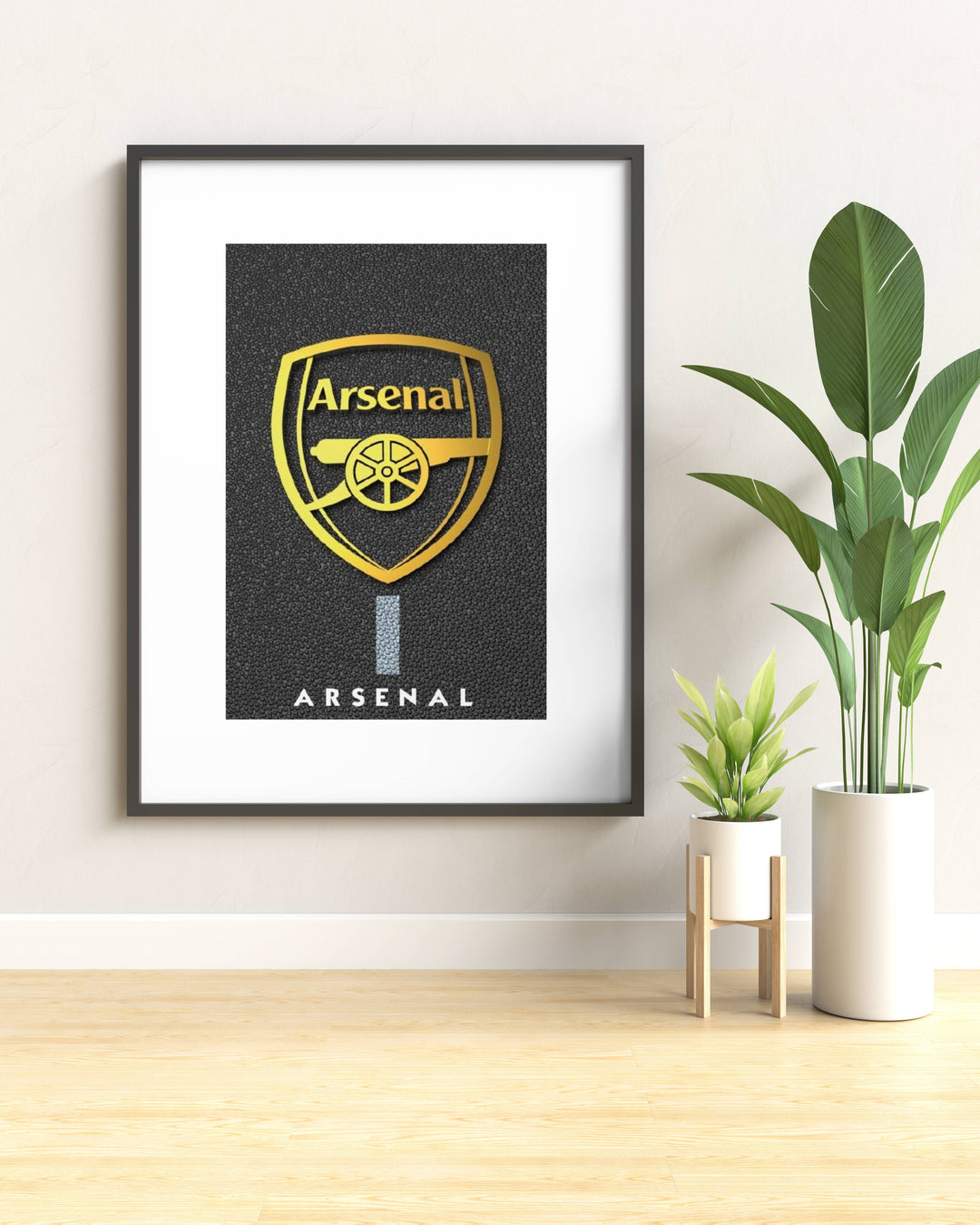 Modern golden Arsenal football club crest framed wall decor. Designed with a dark textured asphalt-style background and a brilliant metallic gold badge finish for sophisticated soccer fans.