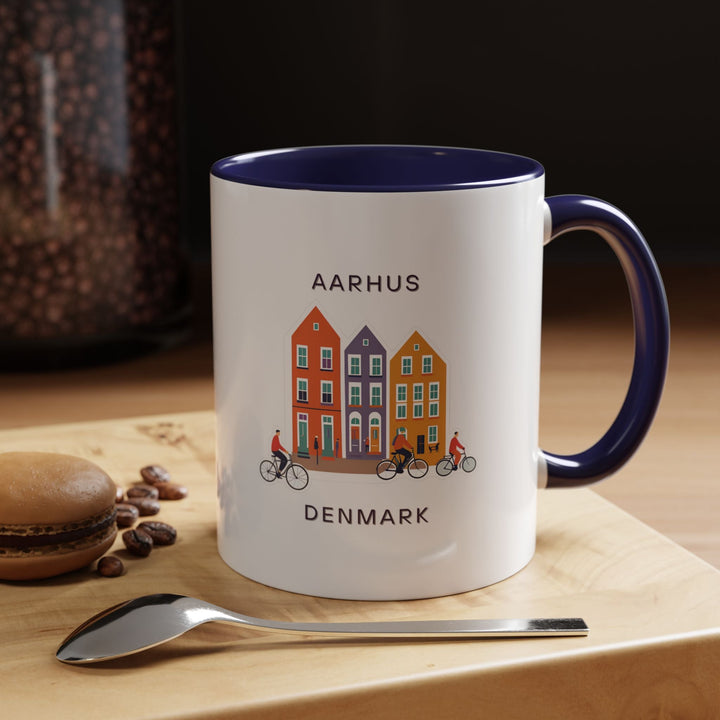 a blue and white coffee mug sitting on top of a wooden table