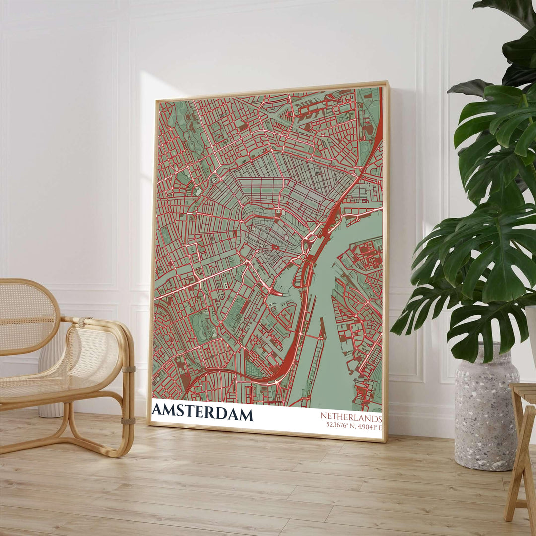 Earthy tone cartography print of an Amsterdam street map with red road networks across sage green terrain and teal waterways, offered by MapYourDreams where you can choose between an unframed archival paper poster, museum stretched canvas, or custom frame finishes for home office decor.