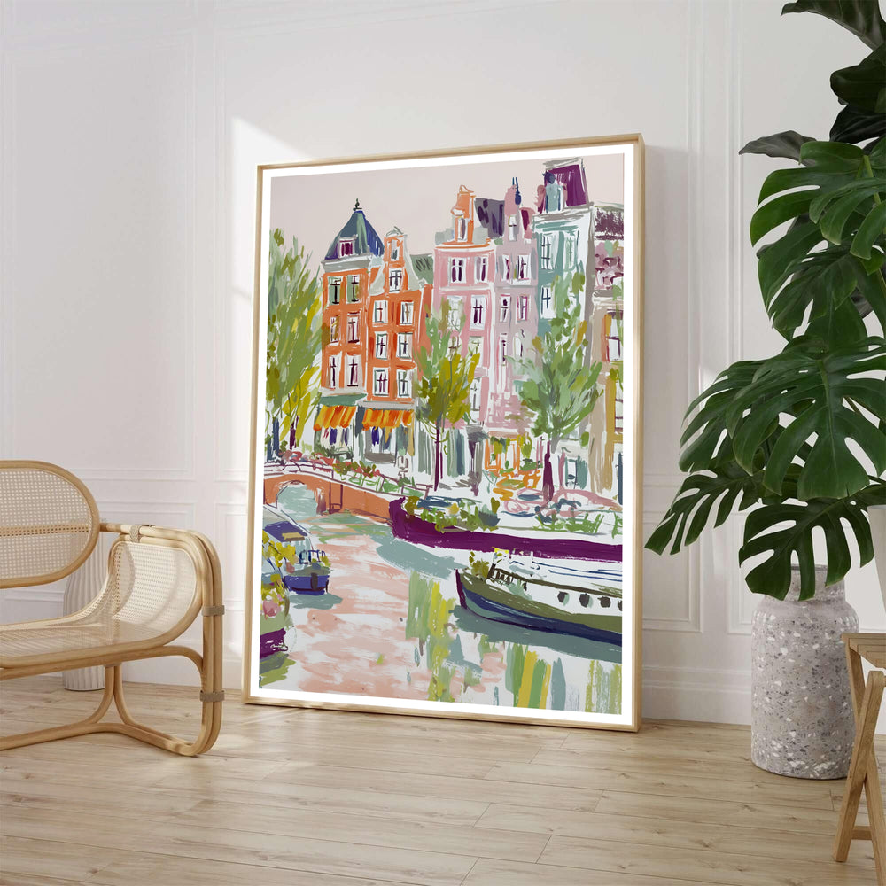Painterly impressionist art print of an Amsterdam canal waterway with traditional townhouses and leafy trees, offered by MapYourDreams where you can choose between an unframed archival paper poster, museum stretched canvas, or custom frame finishes to elevate French country bedroom decor.